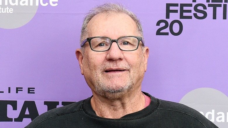 Ed O'Neill laughing wearing glasses