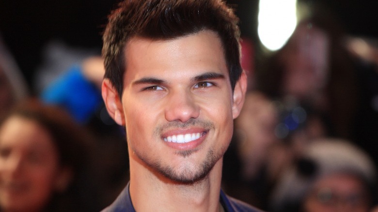 Taylor Lautner smiling at the camera