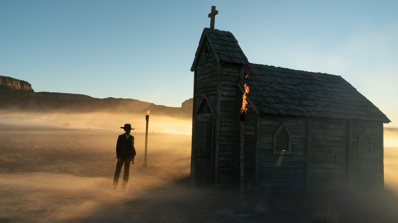 Letitia Wright as Mo Washington standing outside church