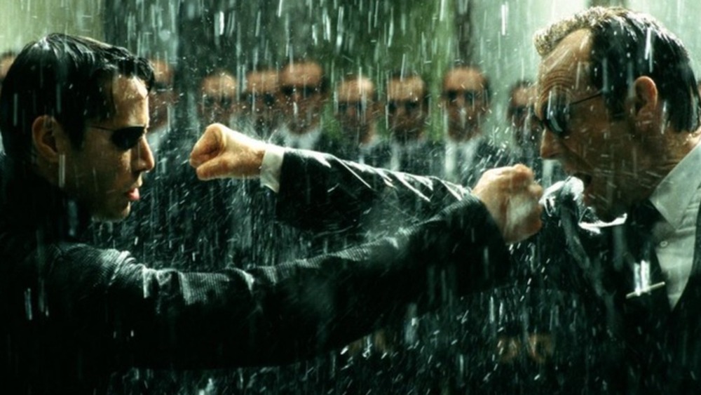 Neo fighting Agent Smith in the rain