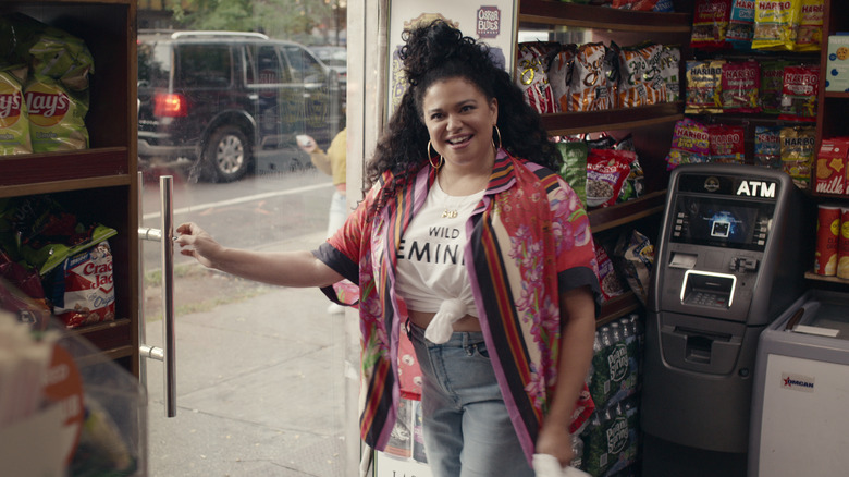 Mavis Beaumont laughing at the door of a convenience store