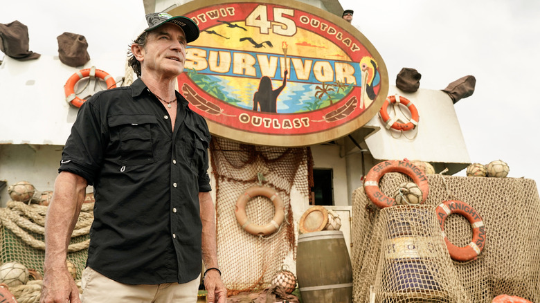 Jeff in front of Survivor 45 sign black shirt