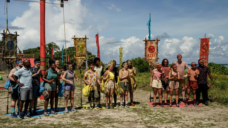 Three Survivor tribes with flags