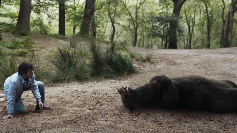 Cocaine Bear Alden Ehrenreich watching a bear