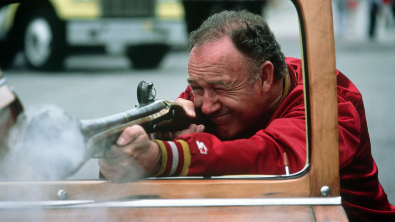 MacArthur Stern shooting a gun through a car window