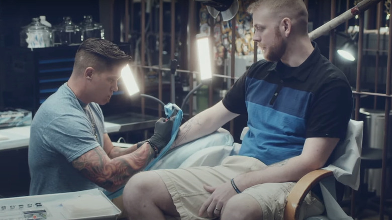 A client getting tattooed