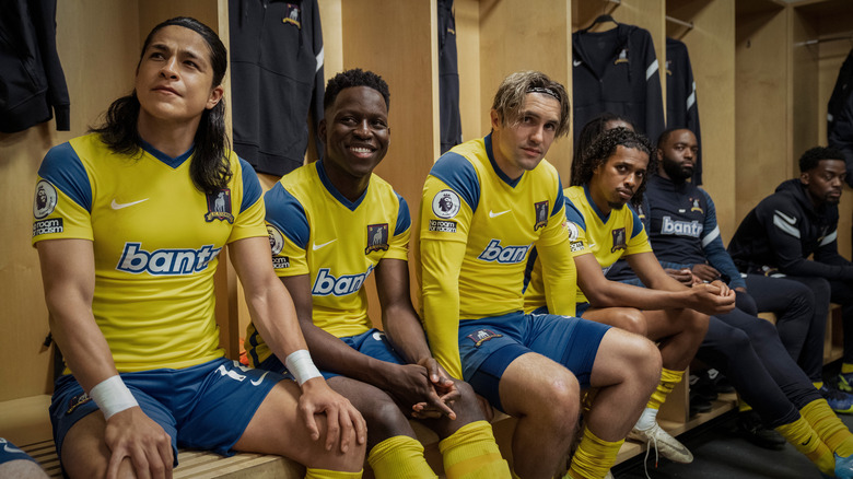 AFC Richmond players sitting in the locker room