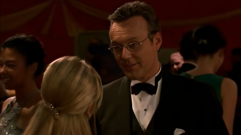 Giles speaking to Buffy in a tux