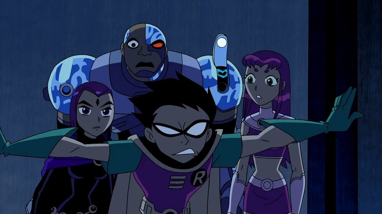 Robin leading Cyborg, Raven, and Starfire