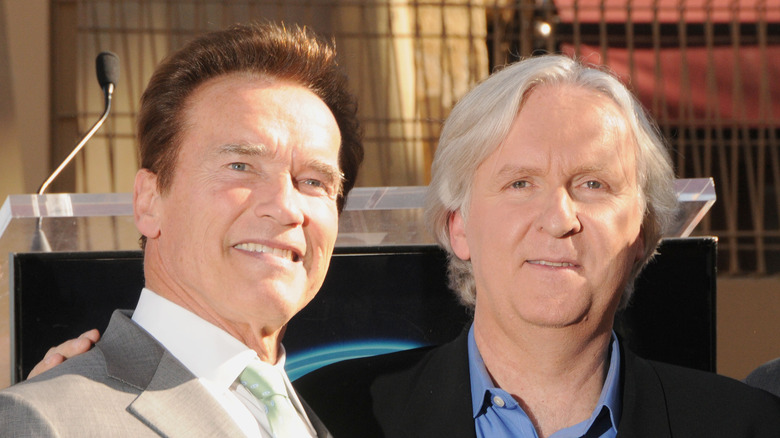 Schwarzenegger poses for a photo with Cameron