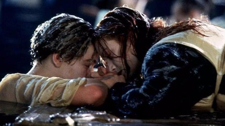 Jack and Rose float on a door in the water