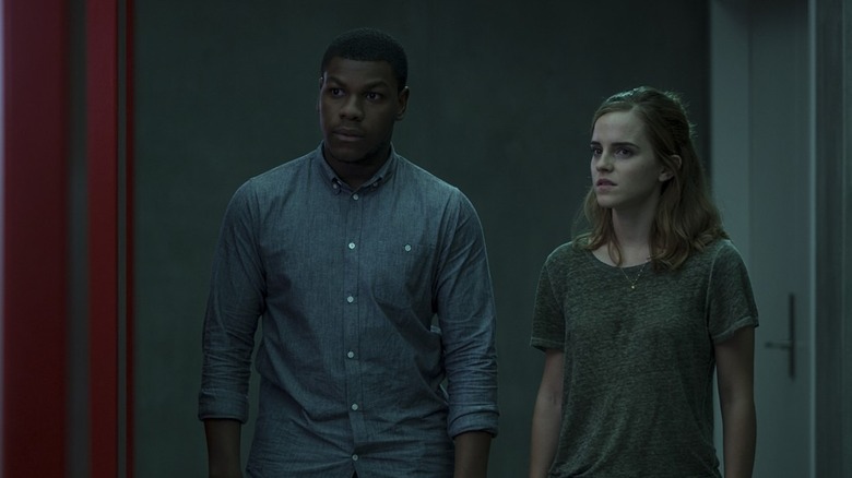 John Boyega and Emma Watson in hallway