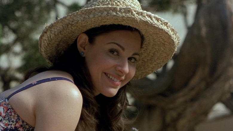 Cara Buono smiling in straw hat