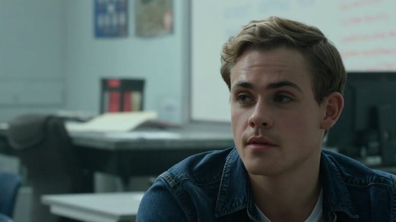 Dacre Montgomery sitting in classroom