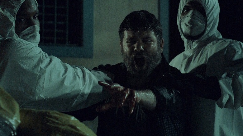 Sean Astin being restrained by doctors