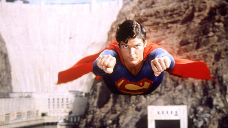 Superman flies away from the dam