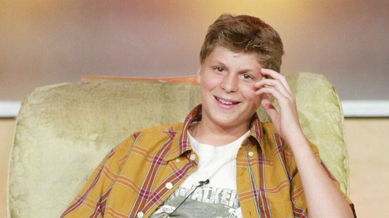 Young Michael Cera sitting