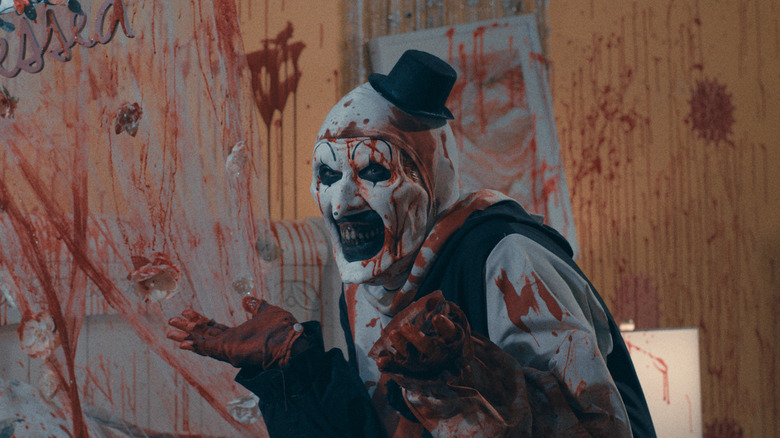 Art the Clown shrugs, splattered with blood