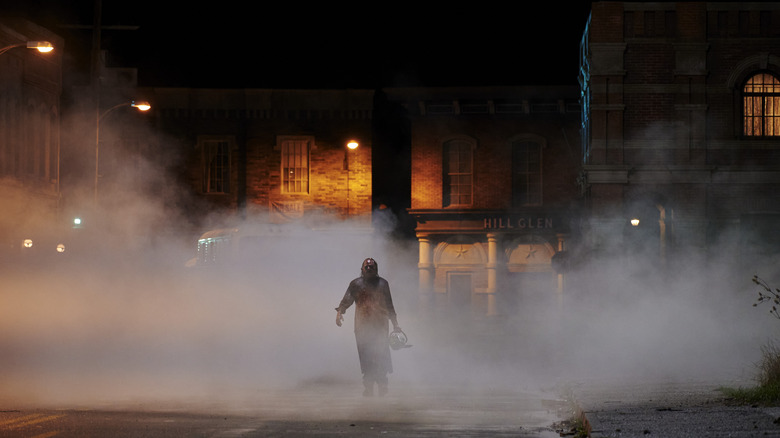 Leatherface walking with his saw