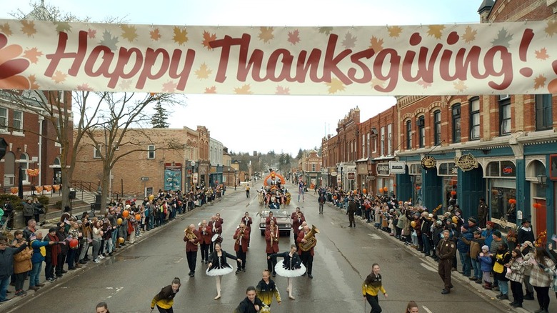 People march in "Thanksgiving's" parade