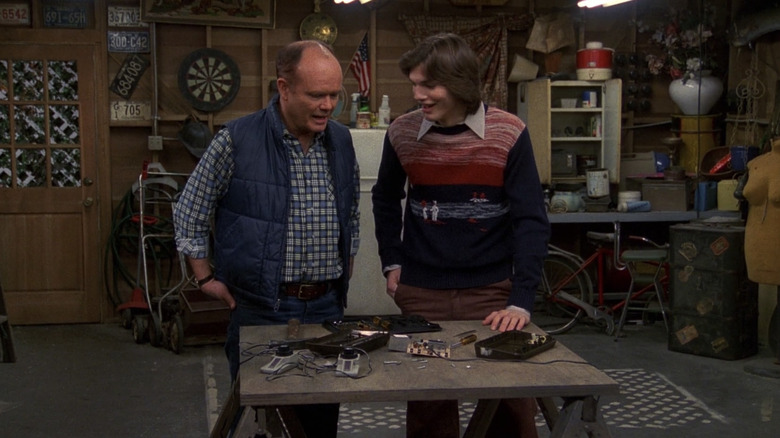 Red Forman teaching Kelso about machines