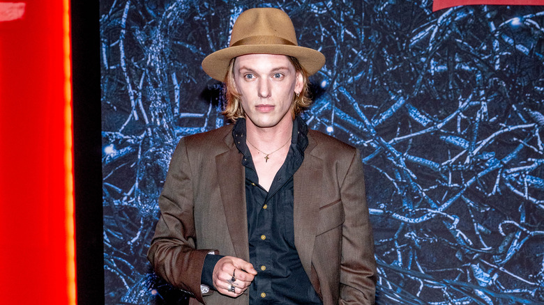 Jamie Campbell Bower looking serious