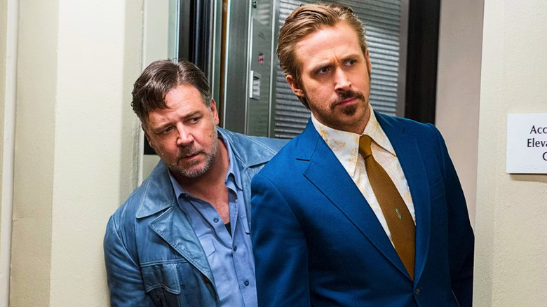 Holland and Jackson peering around a doorway in The Nice Guys