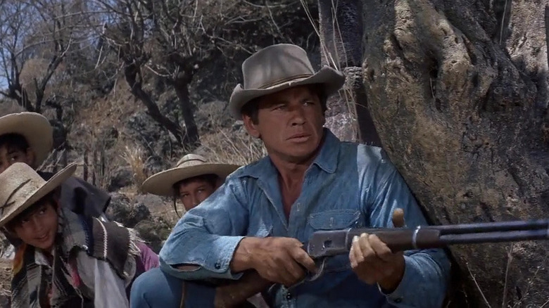 O'Reilly waits behind a tree The Magnificent Seven