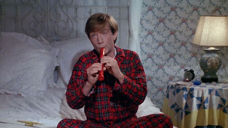 Clifford plays a recorder in "Clifford" (1994)