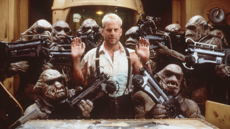 Korben is surrounded by alien soldiers in "The Fifth Element" (1997)