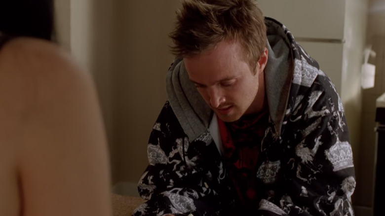 Jesse Pinkman looks down