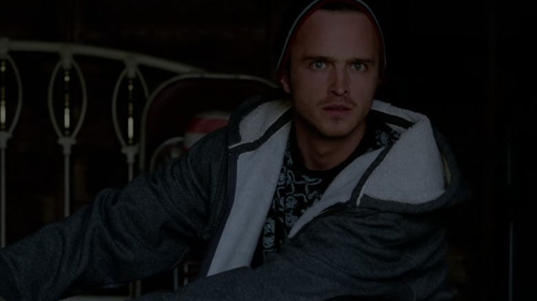 Jesse Pinkman stares at the camera in a gray hoodie