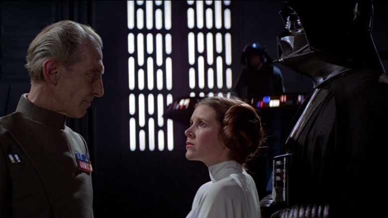 Tarkin, Princess Leia, and Darth Vader talking
