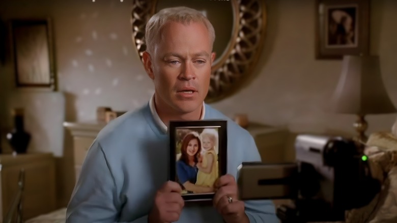 Dave Williams holding a photo