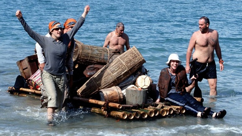 Survivor Borneo cast with boat in water