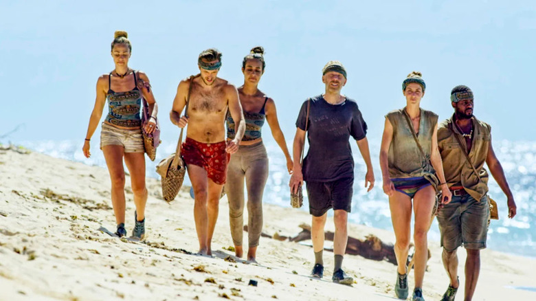 David vs. Goliath finalists walking on beach