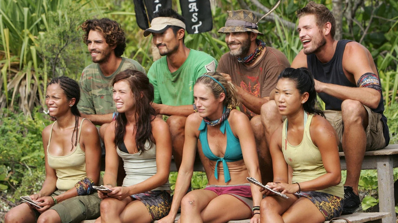 Survivor Cook Islands cast on bleachers listening