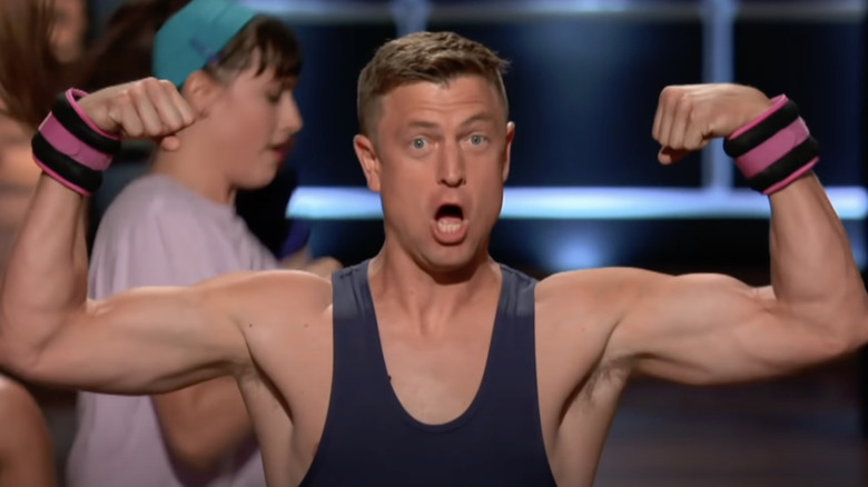 Aerobics instructor flexes during Bala Bangles pitch on Shark Tank