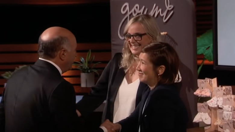 GoumiKids representatives shake hands with Kevin O'Leary on Shark Tank