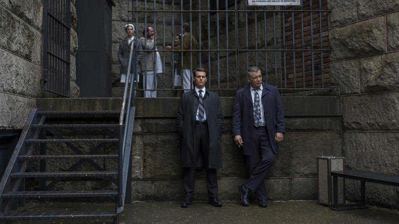 Holden Ford and Bill Tench take a breather outside a prison on "Mindhunter" (2017-2019)