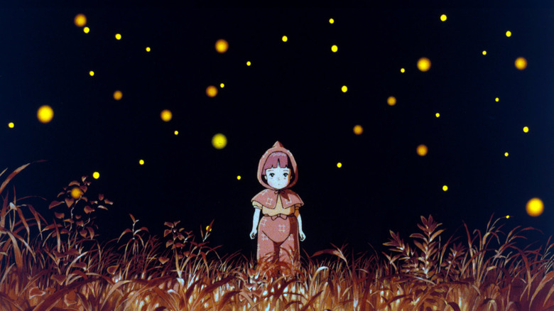 Setsuko stands amidst the fireflies