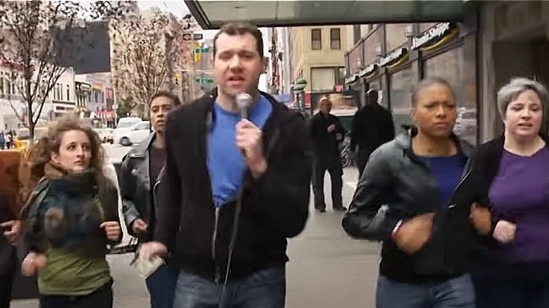 Billy Eichner with 4 women running