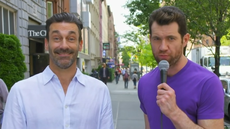 Jon Hamm and Billy Eichner talking to a woman