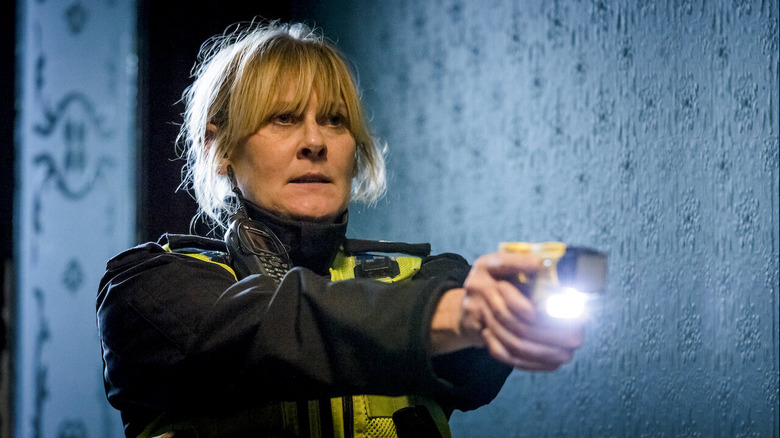 Catherine Cawood holding a stun gun