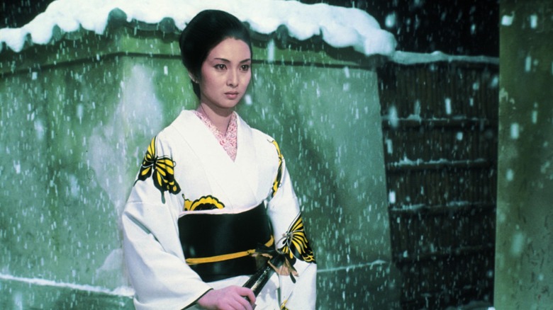 Yuki Kashima ("Lady Snowblood") standing in the snow facing her enemy in Lady Snowblood