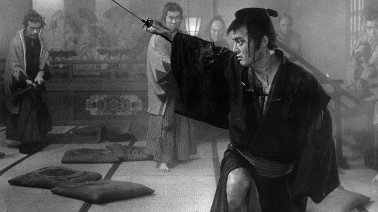 Ryunosuke Tsukue holding up his katana before his enemies in The Sword of Doom