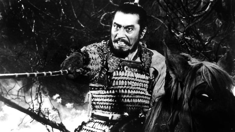 Taketoki Washizu (Macbeth) holding his sword before him in Throne of Blood