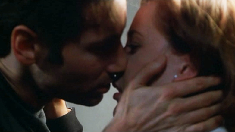 Mulder and Scully about to kiss