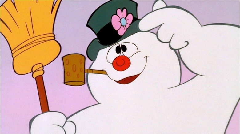 Frosty holding a broom