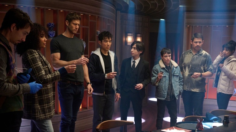 Klaus, Allison, Luther, Ben, Five, Viktor, Diego, and Lila stand together about to take a shot in honor of their sibling bond in The Umbrella Academy